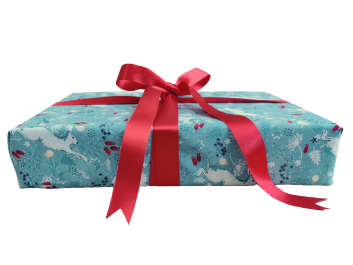 Gift wrapped with White Hares on Sage Fabric Wrapping and Red Ribbon
