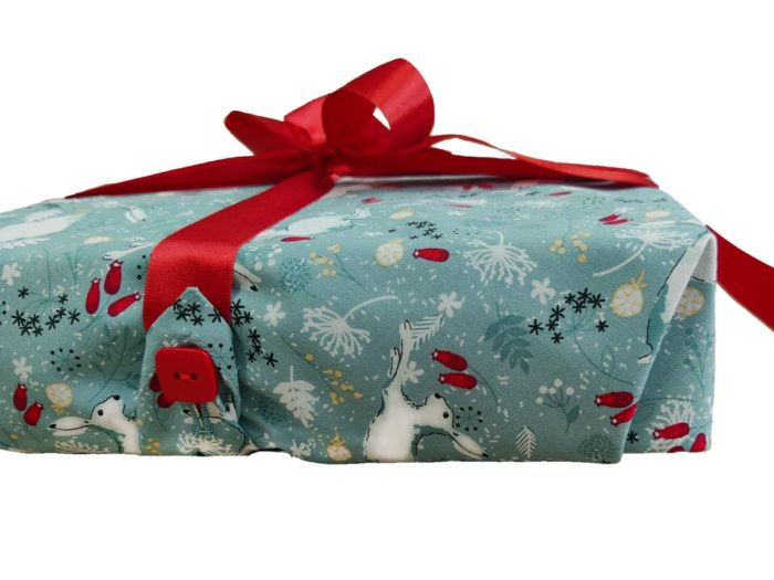 Present Wrapped in Cloth: White Hares on Sage Fabric Wrap and Red Ribbon