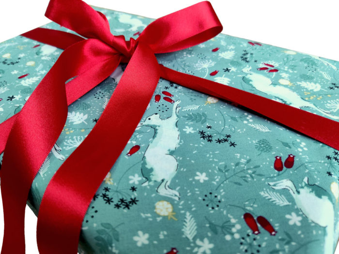 Gift wrapped with White Hares on Sage Fabric Wrapping and Detachable Red Ribbons