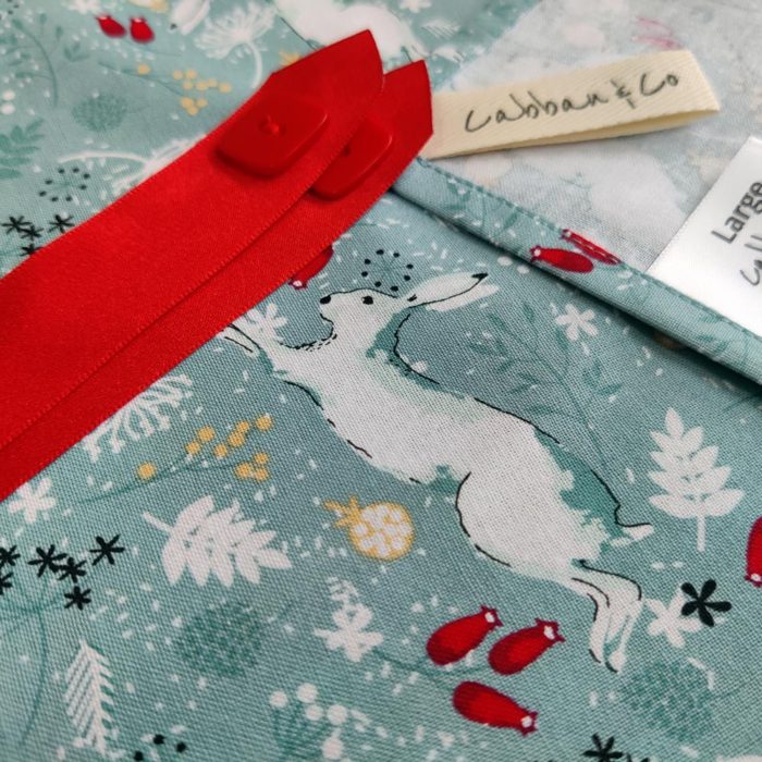 White Hares on Sage background Fabric Wrapping and Red Ribbon
