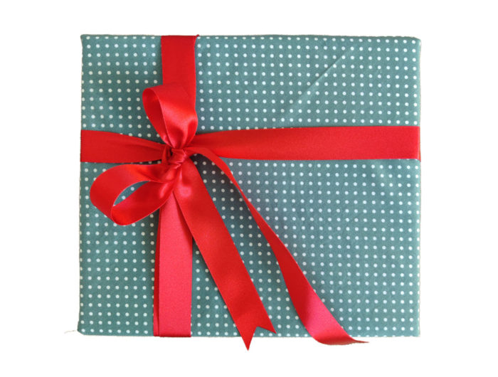 Large present wrapped in Sage Green and White Spot cotton with red satin Ribbon