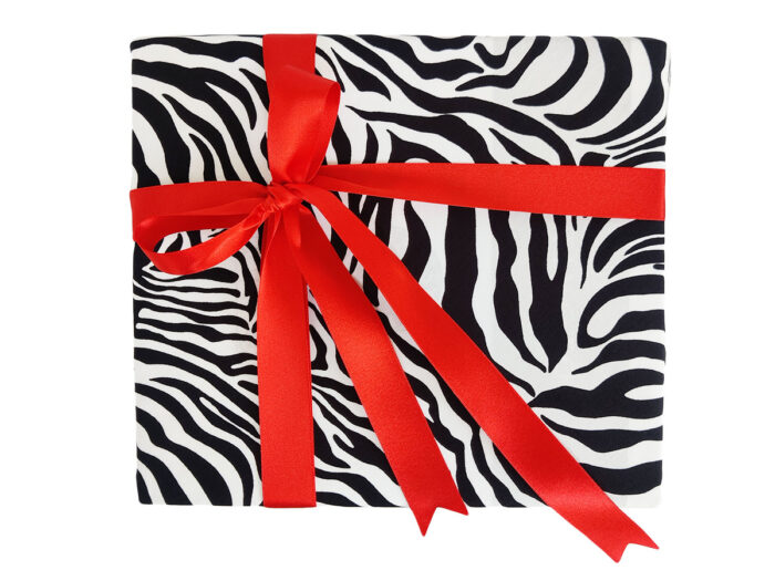 Large Gift wrapped in Zebra print fabric with Red Satin ribbon